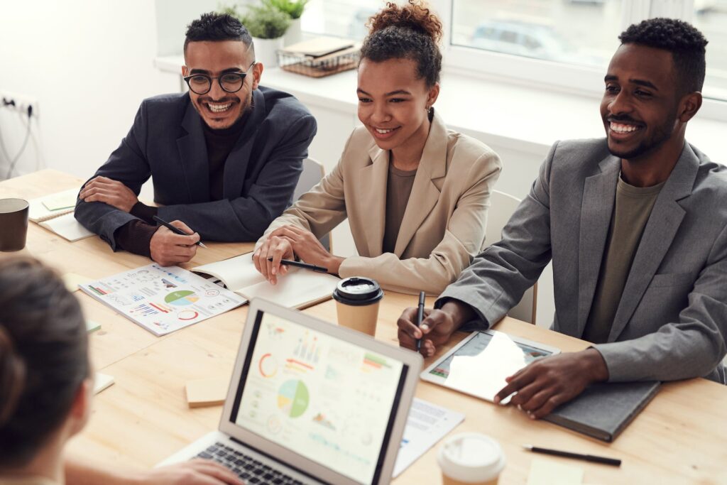 a group of people in a meeting analyzing the database dashboard kpis and metrics